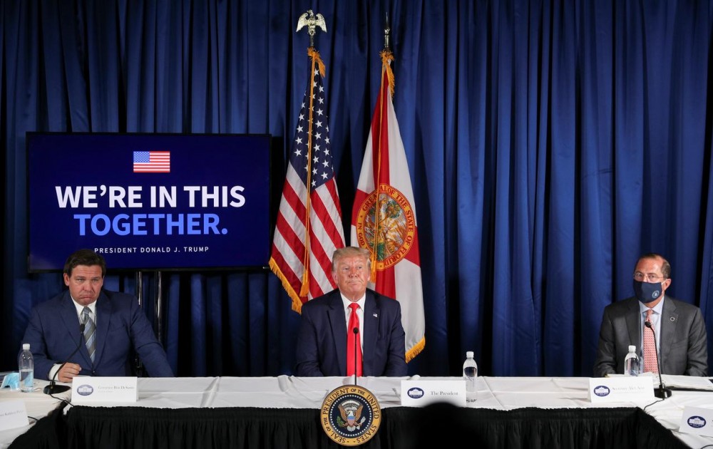U.S. President Donald Trump participates in a "COVID-19 Response and Storm Preparedness" event with Florida Governor Ron DeSantis and U.S. Health and Human Services (HHS) Secretary Alex Azar at the Pelican Golf Club in Belleair, Florida, U.S., July 31, 2020. REUTERS/Tom Brenner